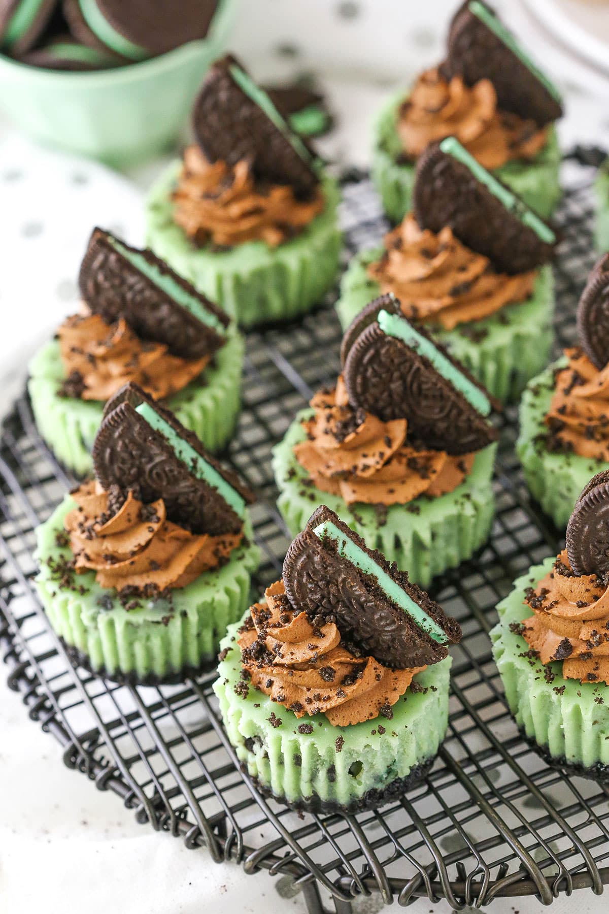 Overhead view of Mini Mint Chocolate Oreo Cheesecakes on a gray metal stand