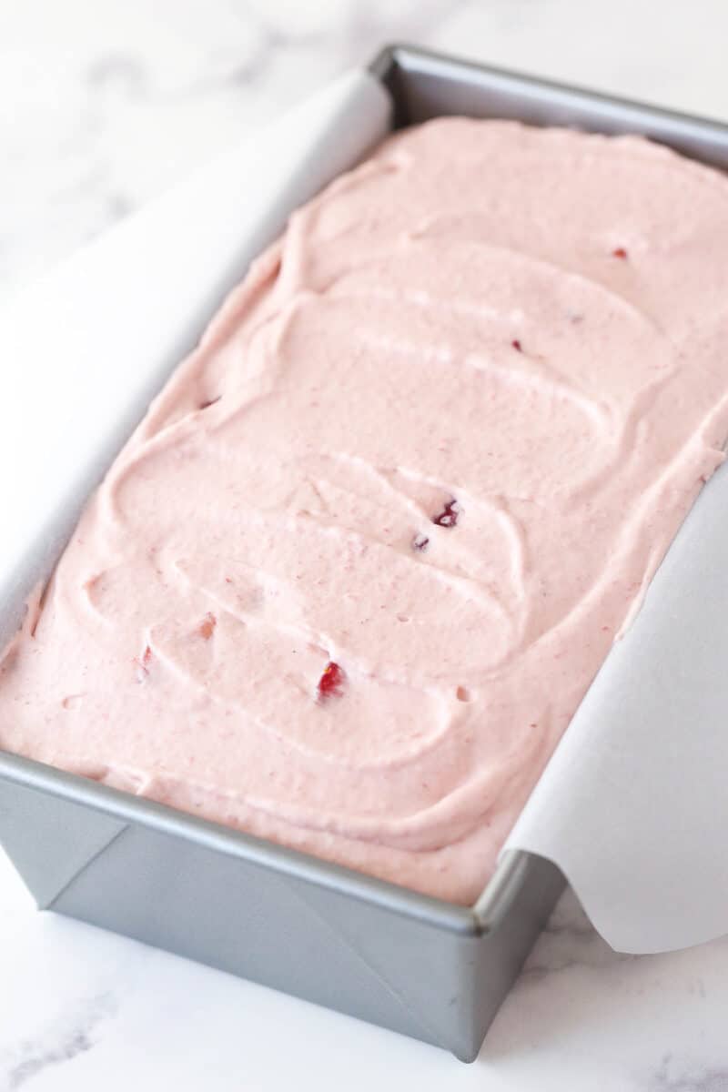 no churn strawberry ice cream in loaf pan, ready to freeze