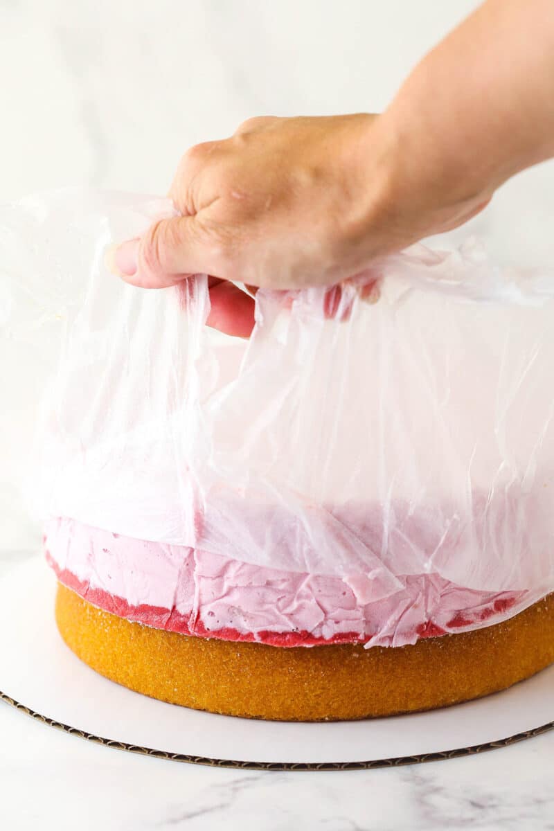 Removing clear wrap from inverted ice cream cake.