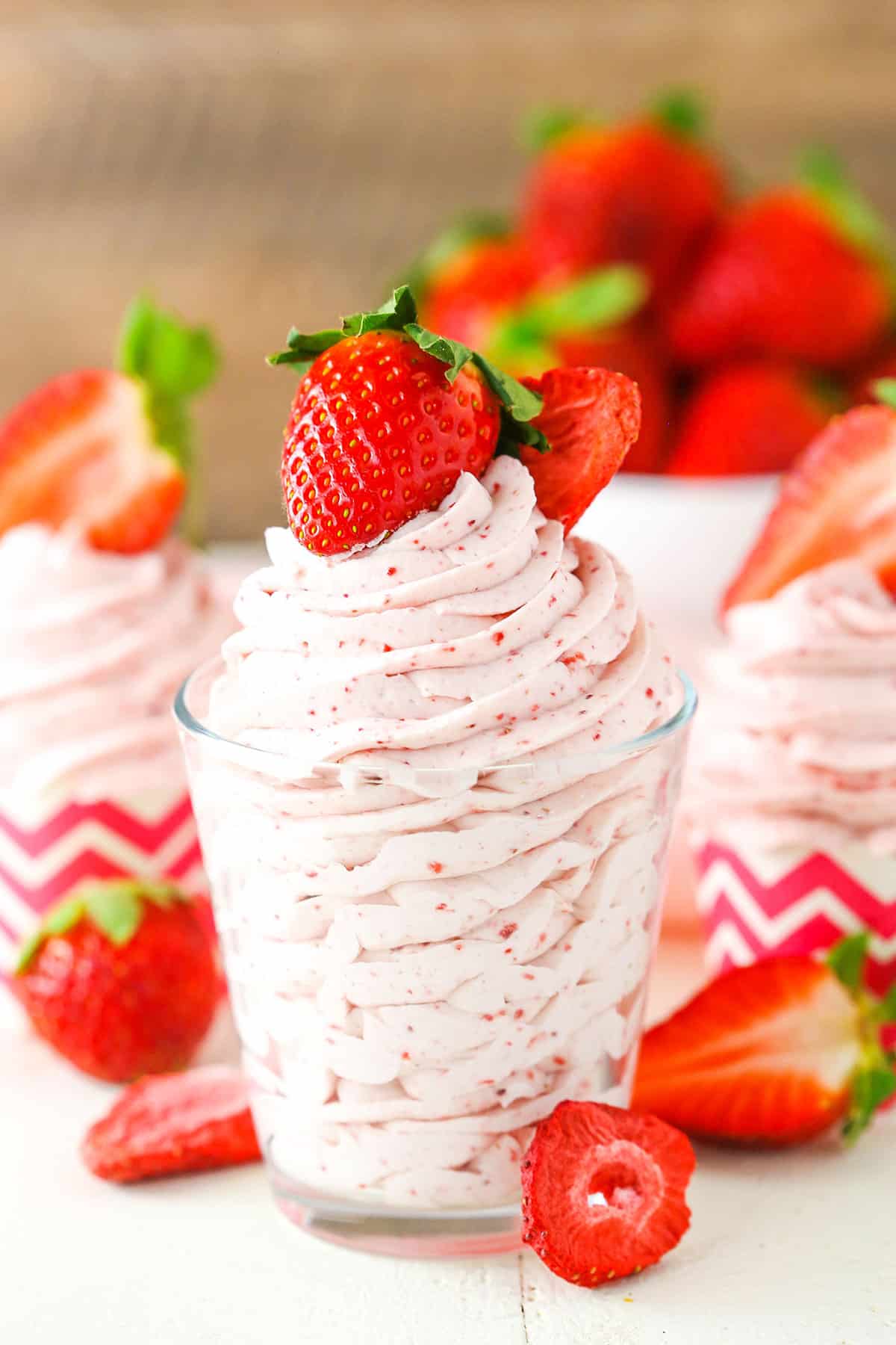 Homemade Strawberry Whipped Cream piped into a clear glass