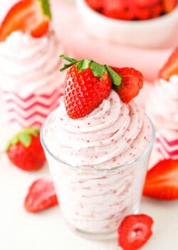 Homemade Strawberry Whipped Cream piped into a clear glass