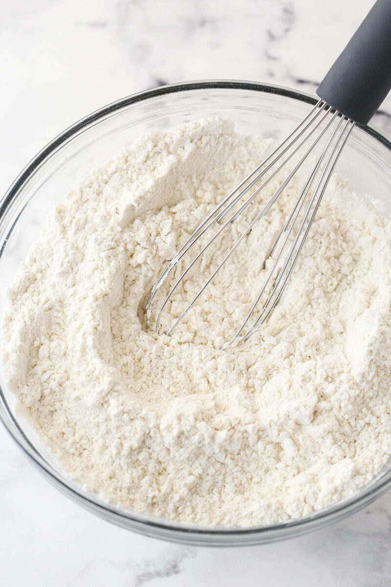 Whisking together dry ingredients for cookie dough.