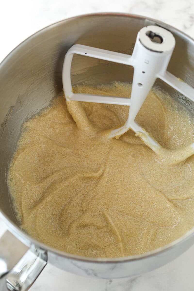 Creaming together butter, oil, sugars, and vanilla for cake batter.