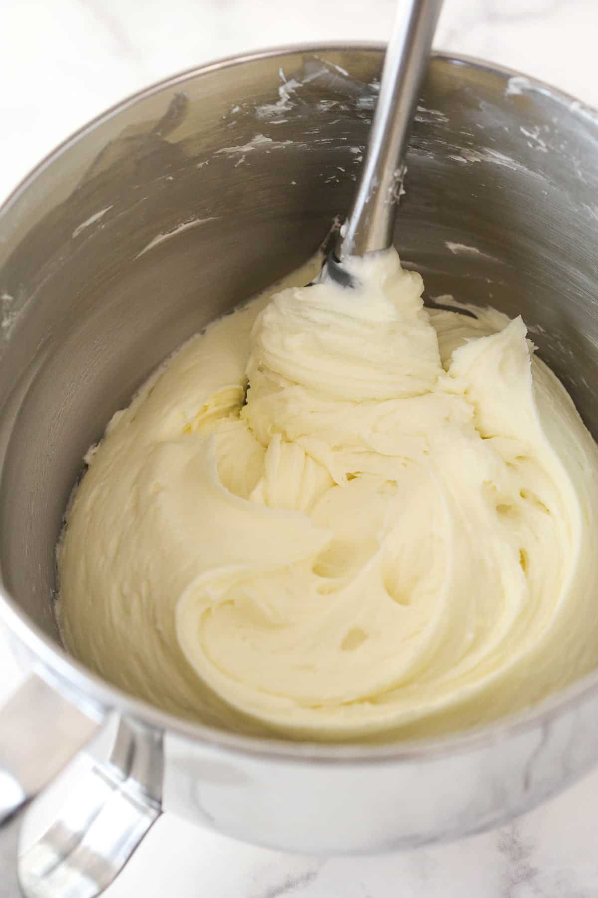 Cream cheese frosting in a mixing bowl.