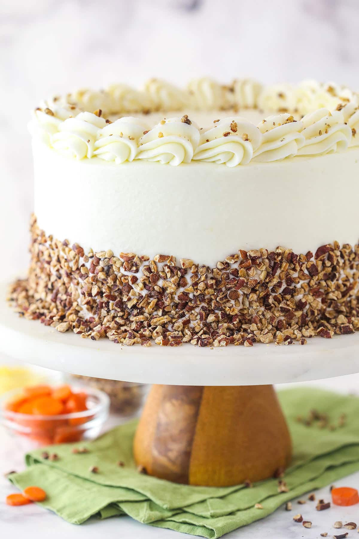 Carrot cake on a cake stand.