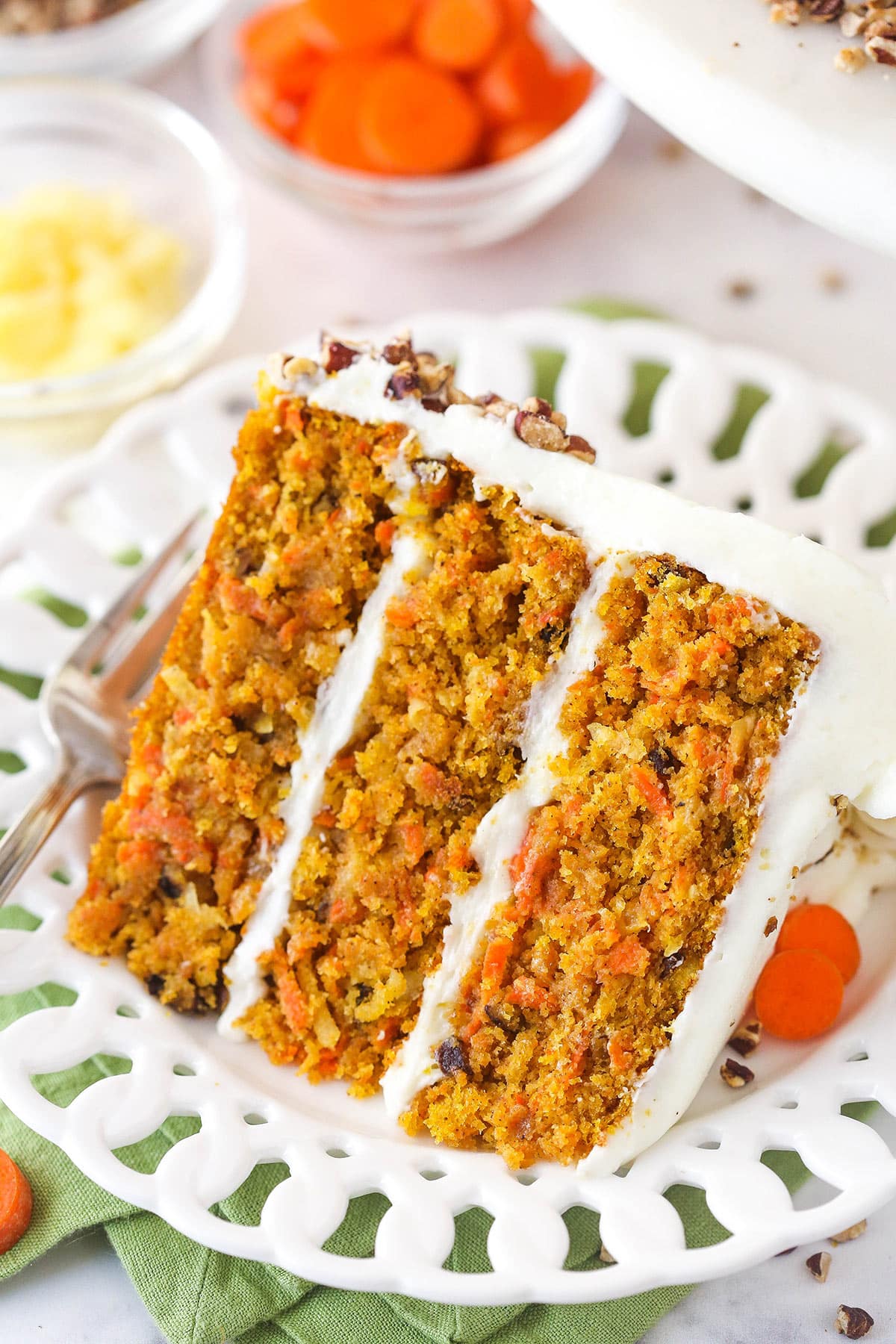 A slice of carrot cake on a plate.