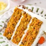 A slice of carrot cake on a plate.