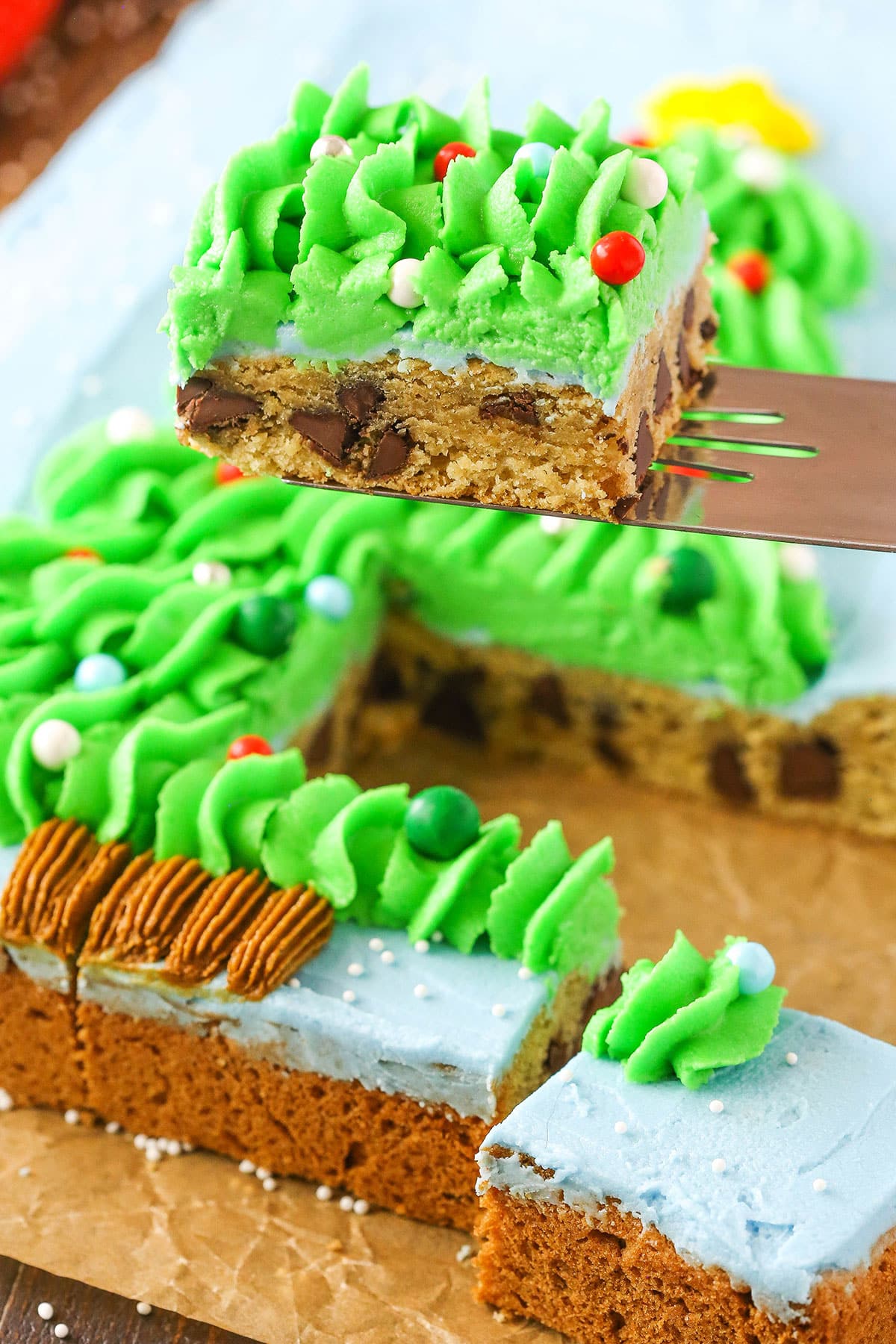 A square slice of Christmas Tree Chocolate Chip Cookie Cake
