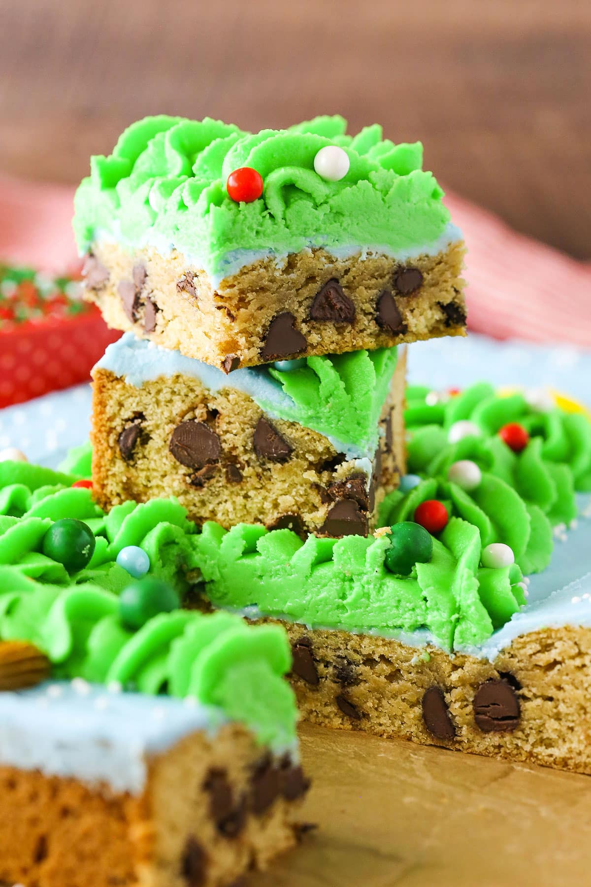 Two square slices of Christmas Tree Chocolate Chip Cookie Cake stacked