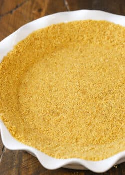Easy Graham Cracker Crust in a white platter on a wooden table