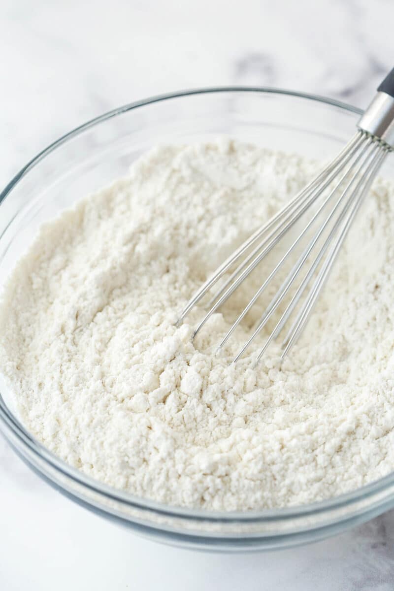 Moist, fluffy, & tender, vanilla cupcakes have the perfect, subtle vanilla flavor & are topped with the most incredible vanilla buttercream. Whisking together dry ingredients or cupcake batter.