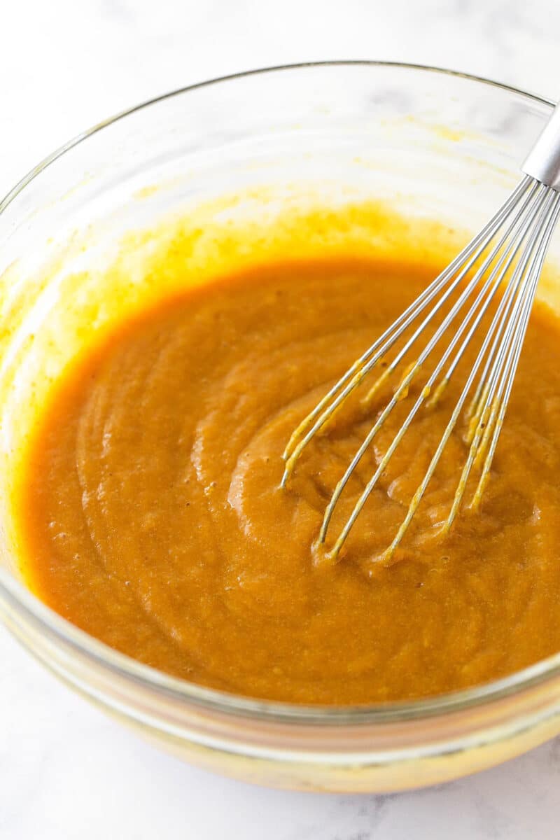 Whisking together the pumpkin puree, eggs and light brown sugar.