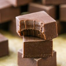 A stack of 3 pieces of chocolate fudge
