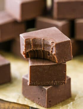 A stack of 3 pieces of chocolate fudge
