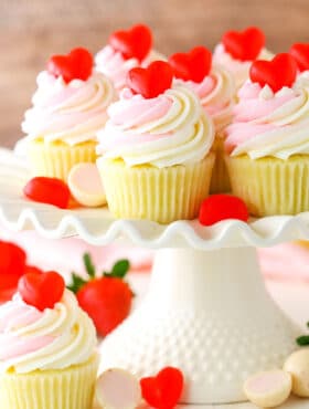 Strawberry Truffle Cupcakes on a white cake stand