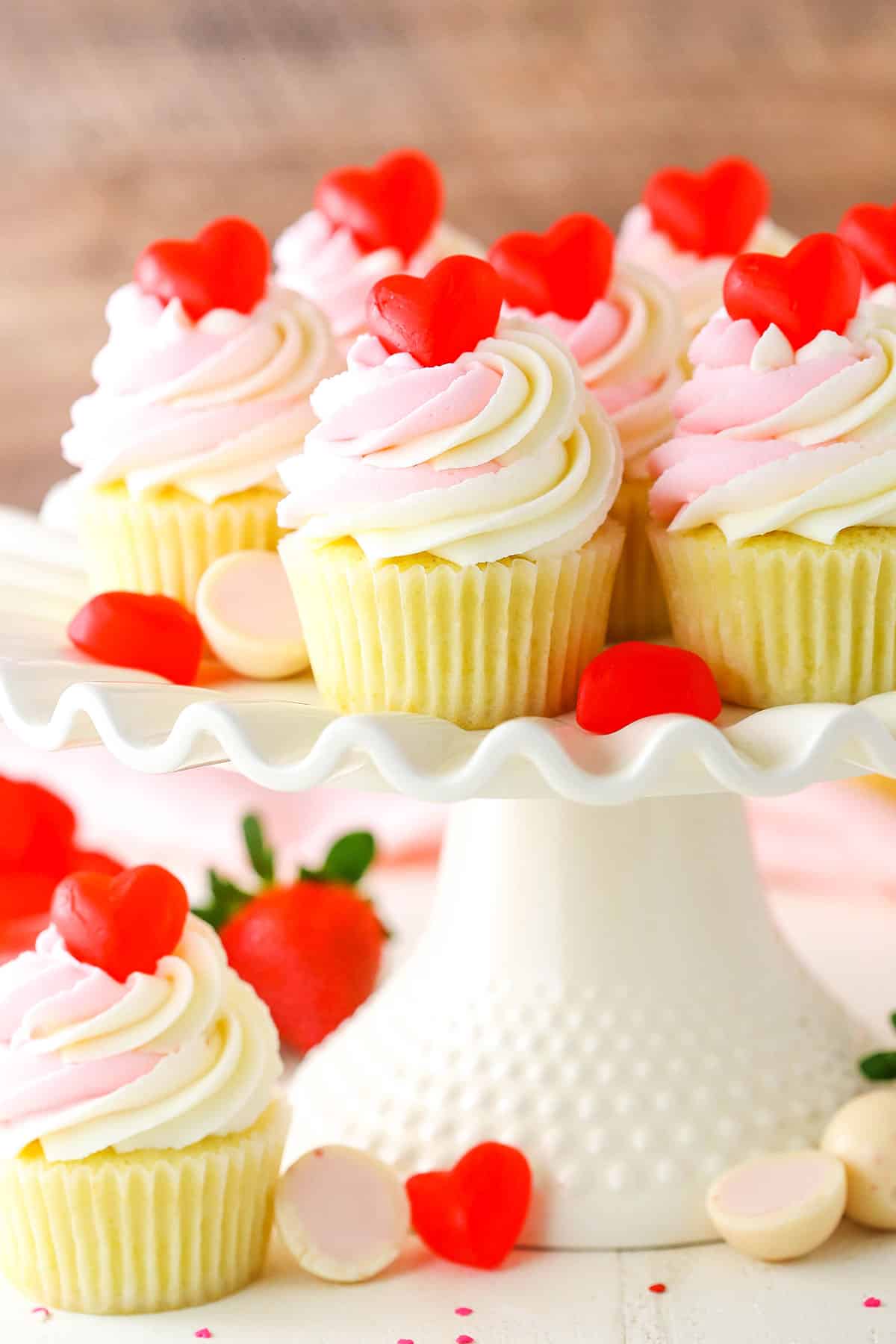 Strawberry Truffle Cupcakes on a white cake stand