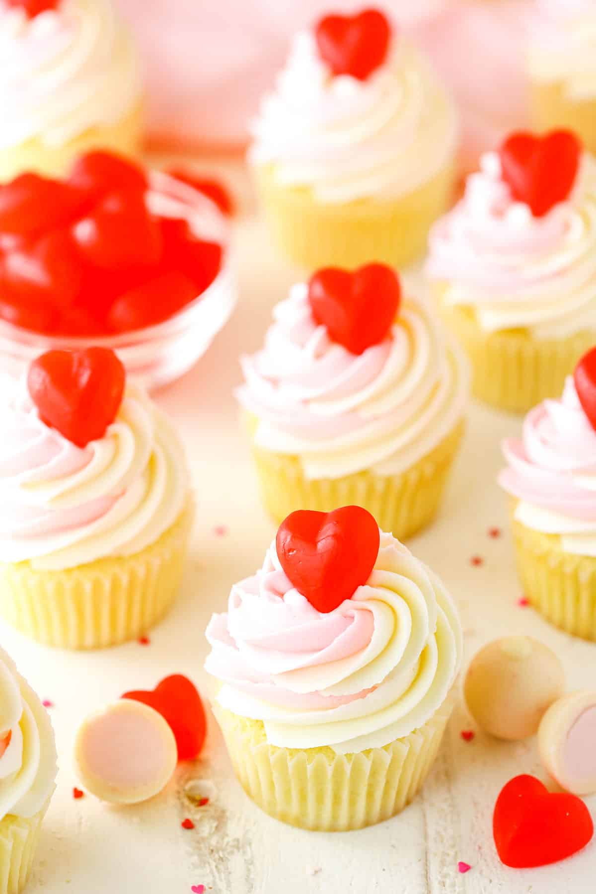 Overhead view of Strawberry Truffle Cupcakes on a white table