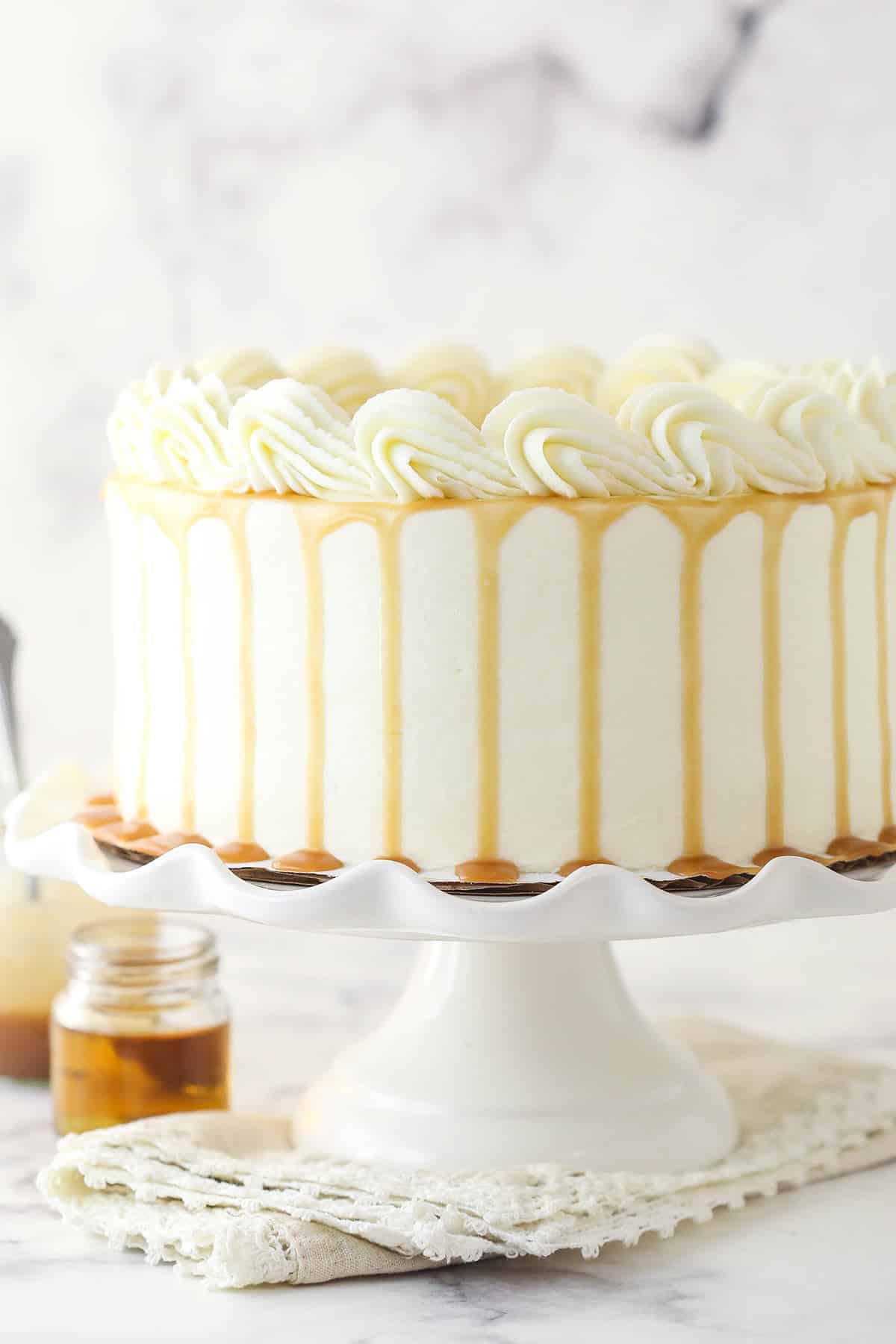 Vanilla bourbon cake on a cake stand.