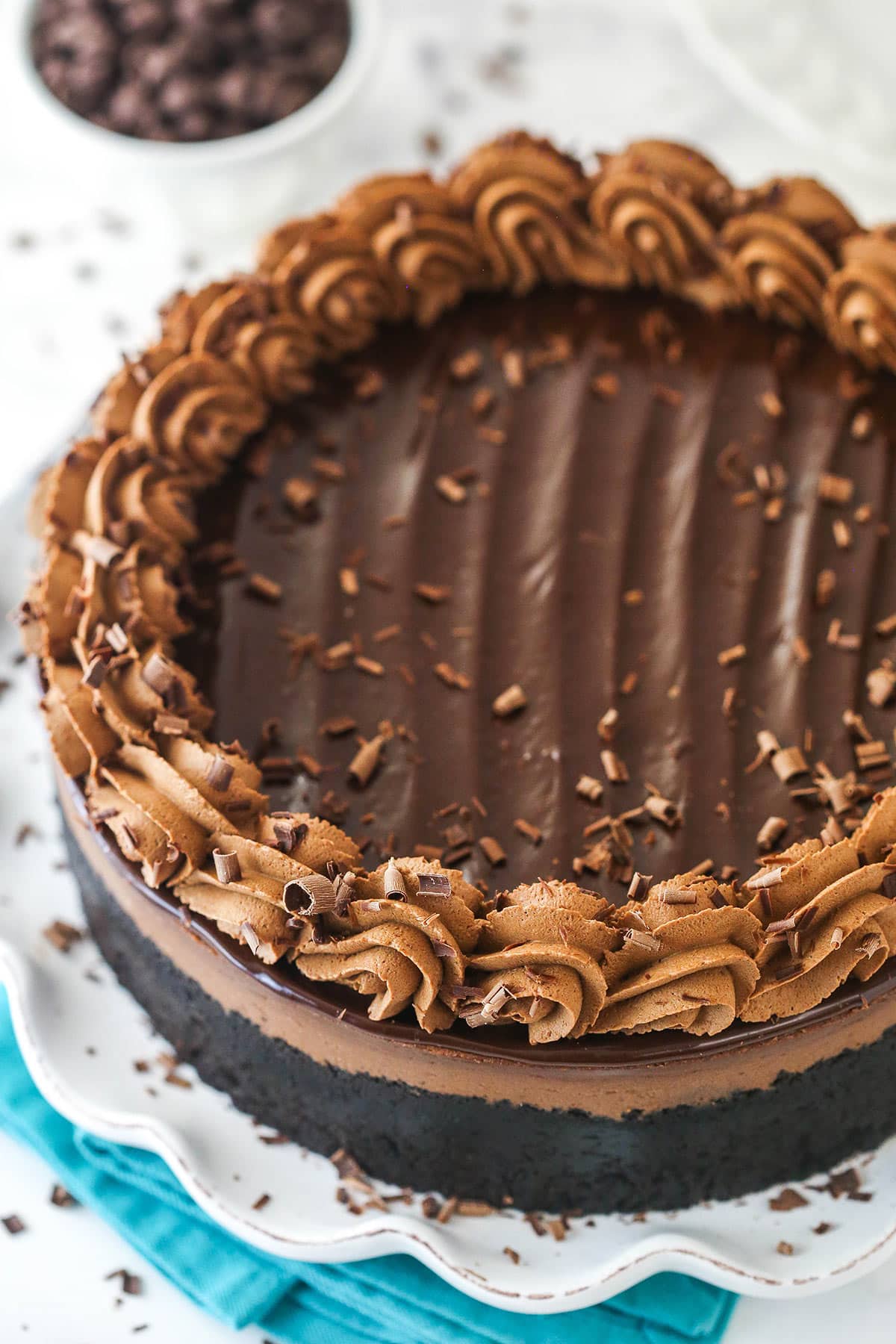 Overhead image of chocolate cheesecake on a serving platter.