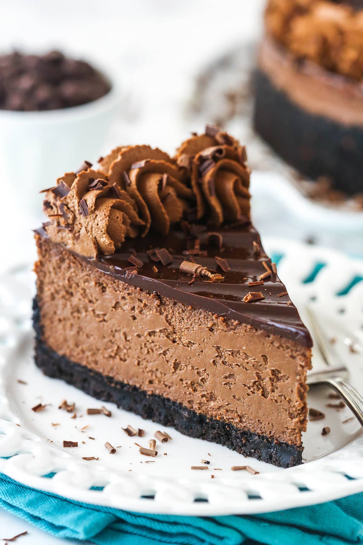 A slice of chocolate cheesecake on a plate.