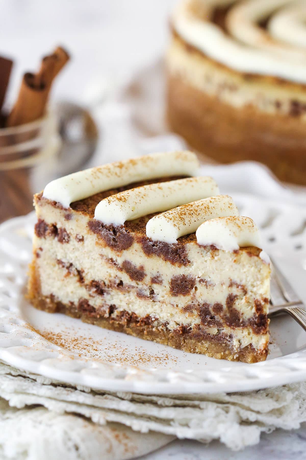 A slice of cinnamon roll cheesecake.