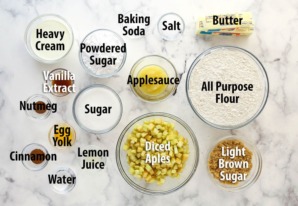 Ingredients for copycat Crumbl apple crumb cake cookies set out on a marble background and labeled.