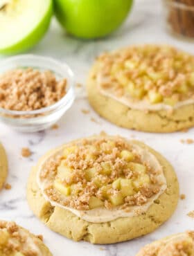 Close up of a fully decorated Copycat Crumbl Apple Crumb Cake Cookie.