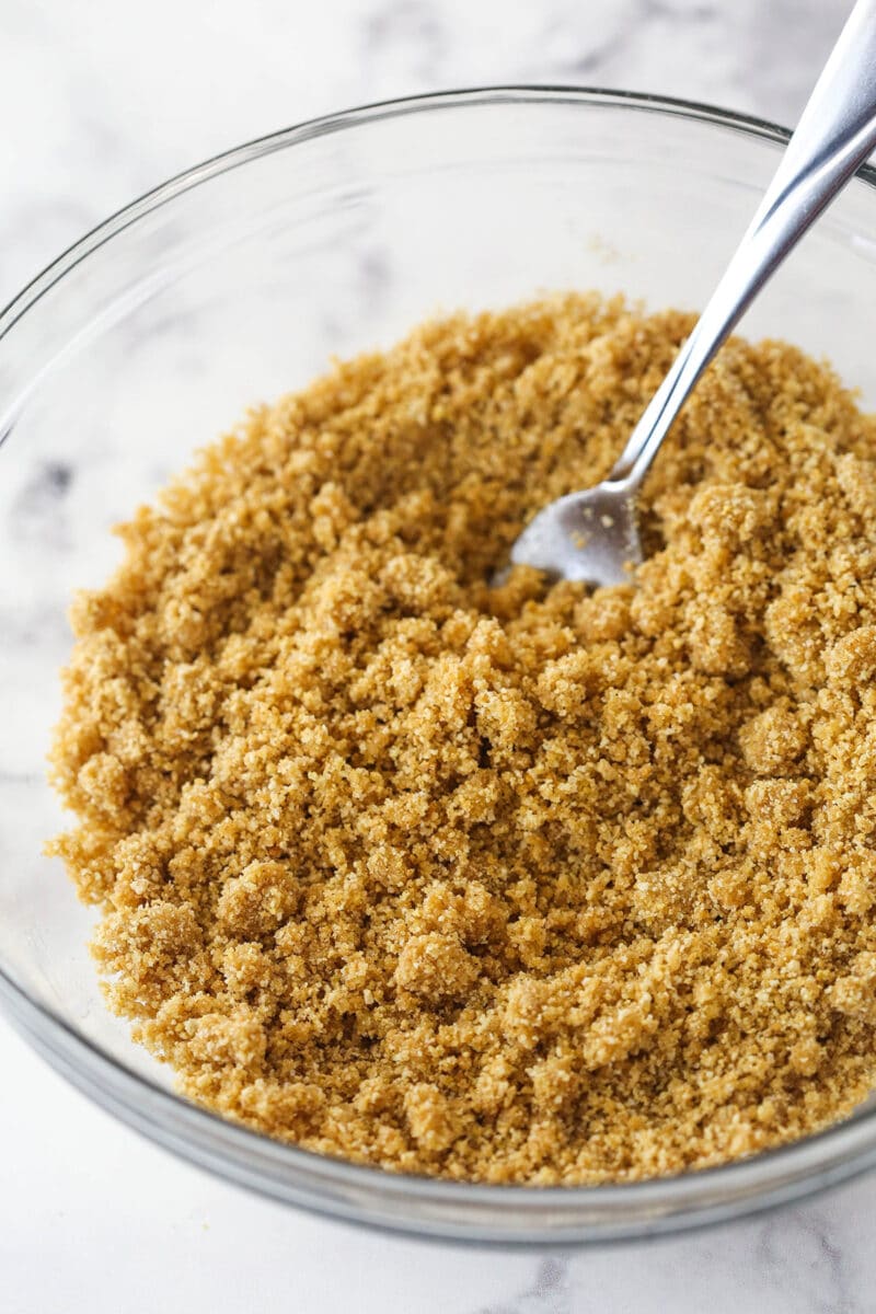 Mixing together the ingredients for graham cracker crust.