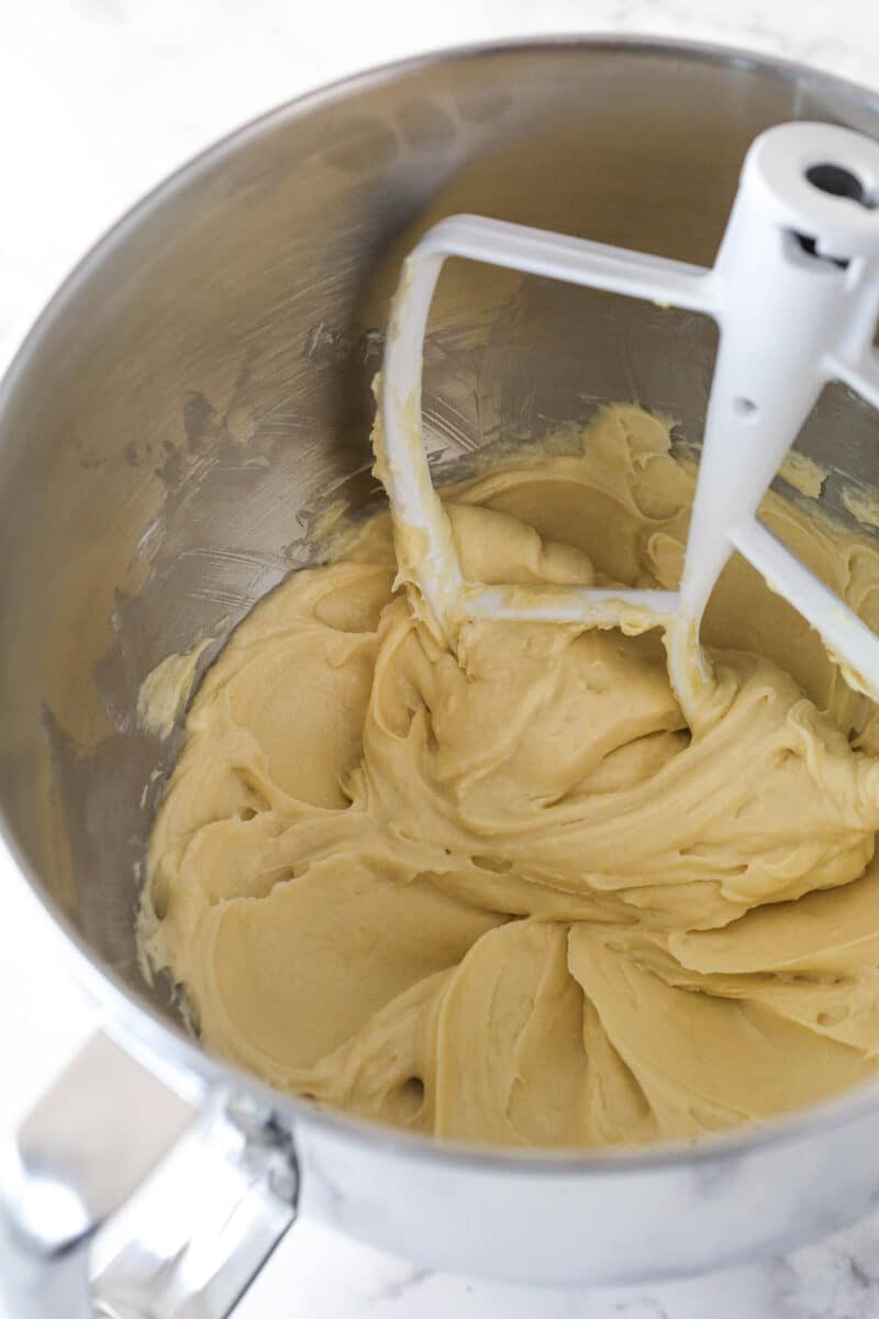 Beating together cream cheese, brown sugar, and flour for mini cheesecake filling.