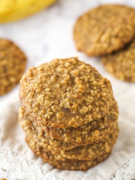 Top view of 6 Moist and Chewy Banana Oatmeal Cookies stacked one on top of the other.