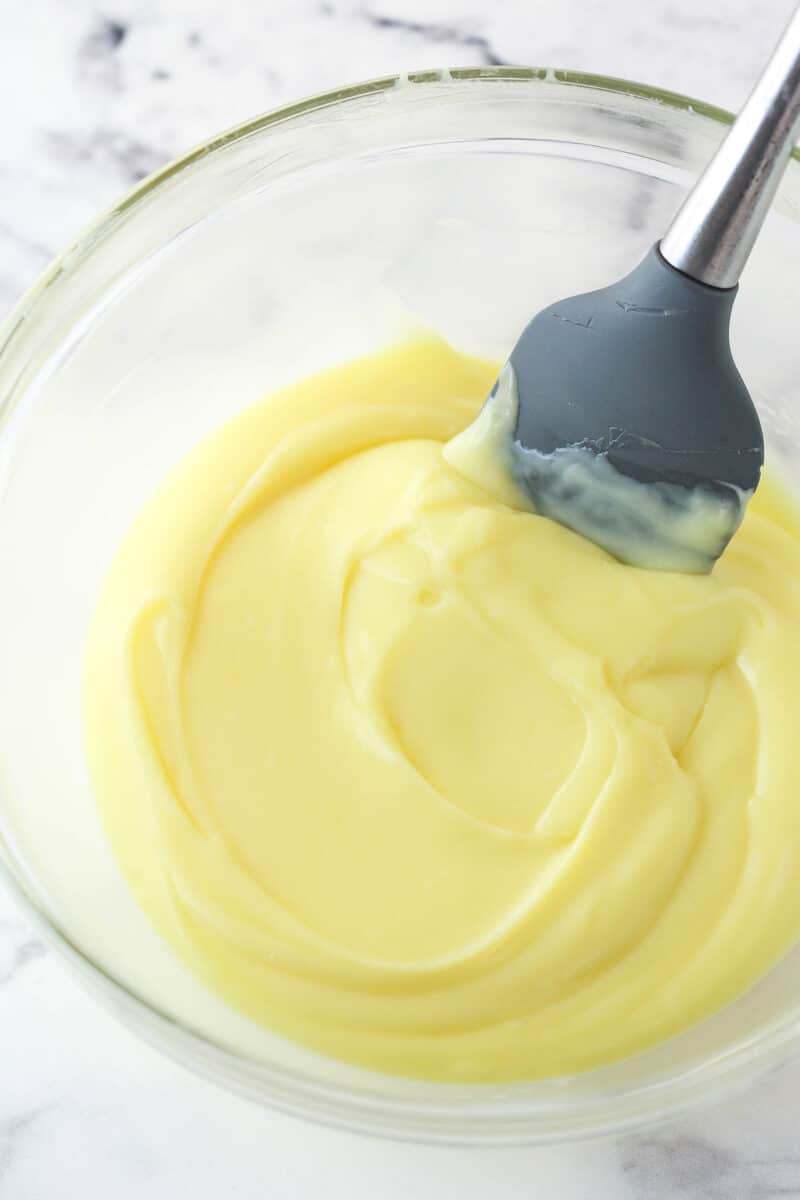 Mixing pastry cream with a rubber spatula.