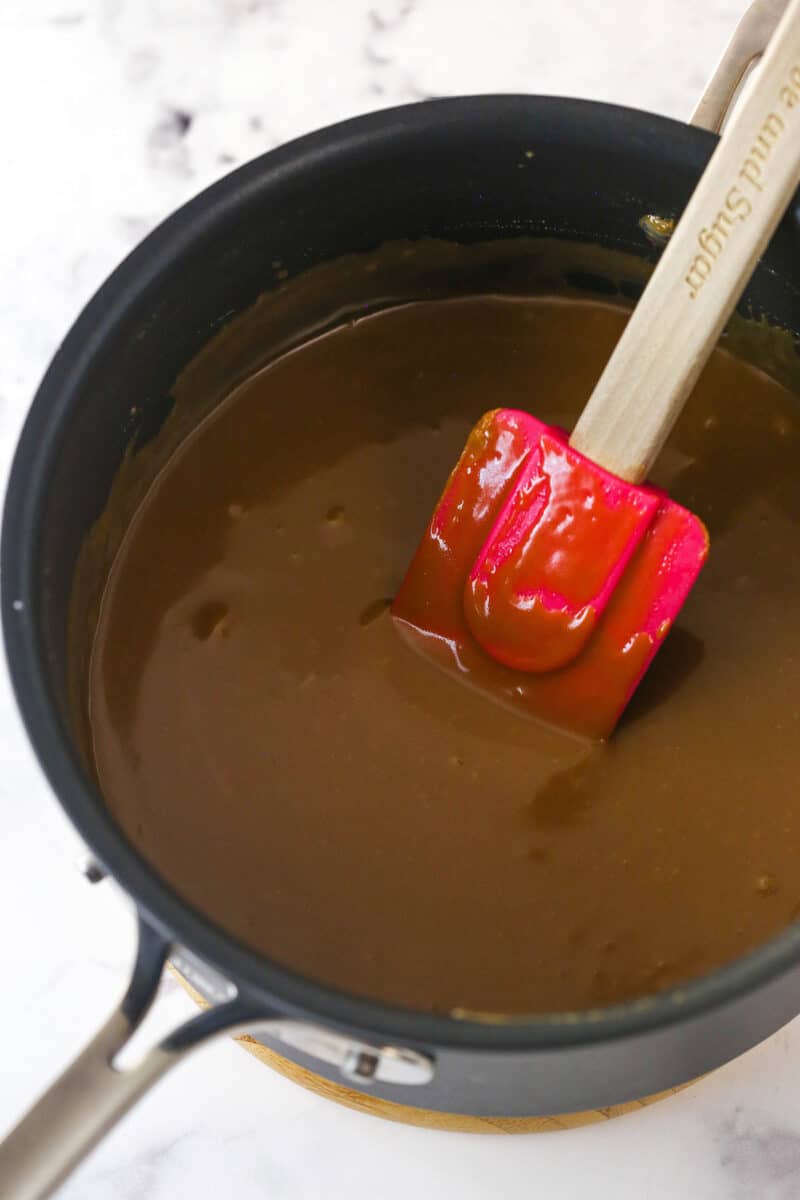 Cooking caramel filling for turtle pie.