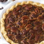 Chocolate pecan pie in a pie dish.