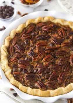 Chocolate pecan pie in a pie dish.