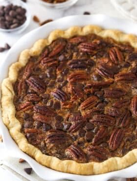 Chocolate pecan pie in a pie dish.