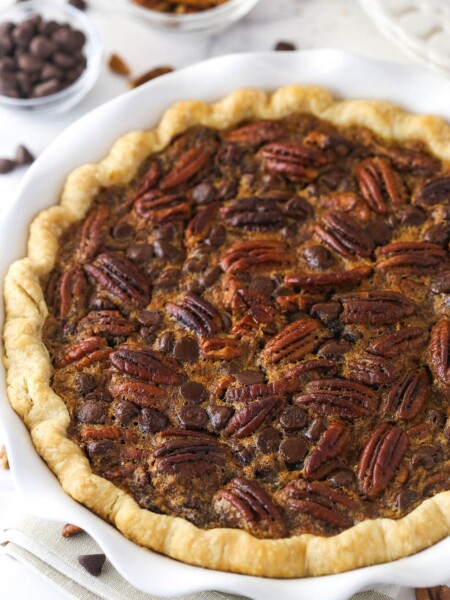 Chocolate pecan pie in a pie dish.