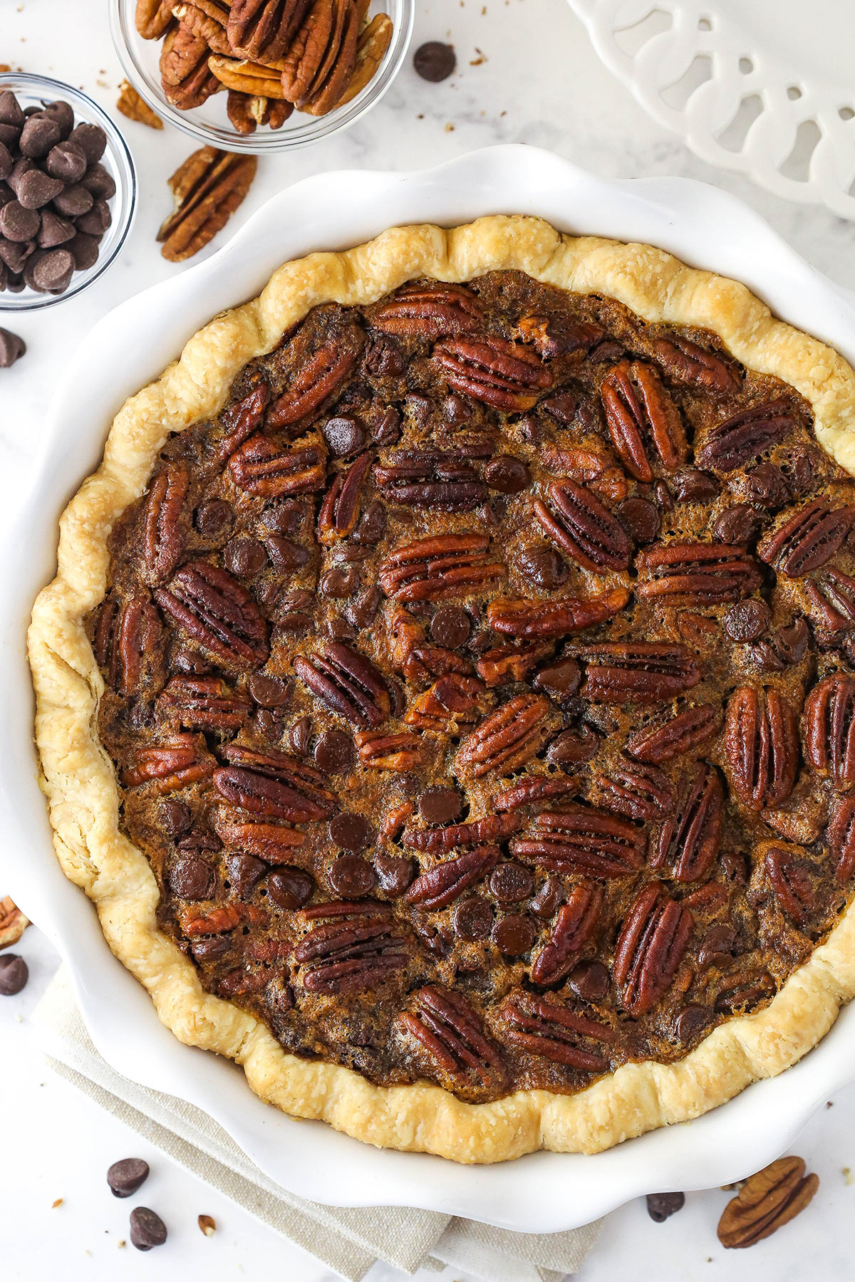 Overhead image of chocolate pecan pie in a pie dish.