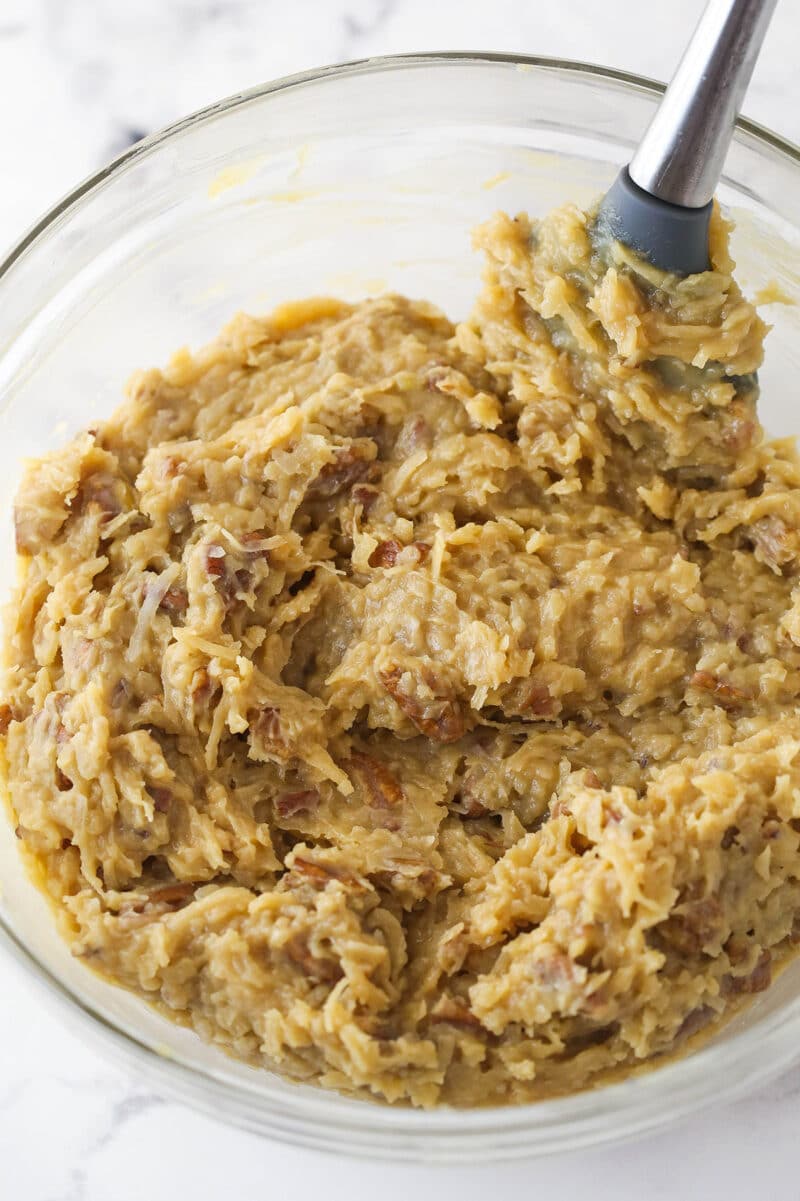 Coconut pecan cake filling chilled in a bowl.