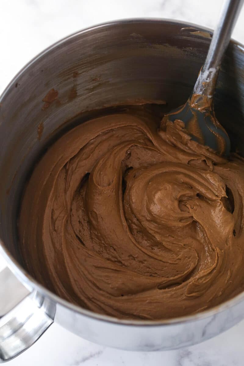 Adding dry ingredients and buttermilk to German chocolate cake batter.