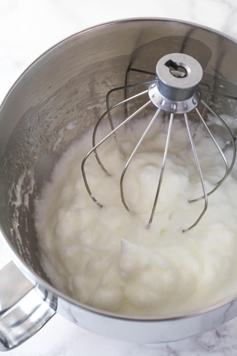 Whipping egg whites in a mixing bowl.