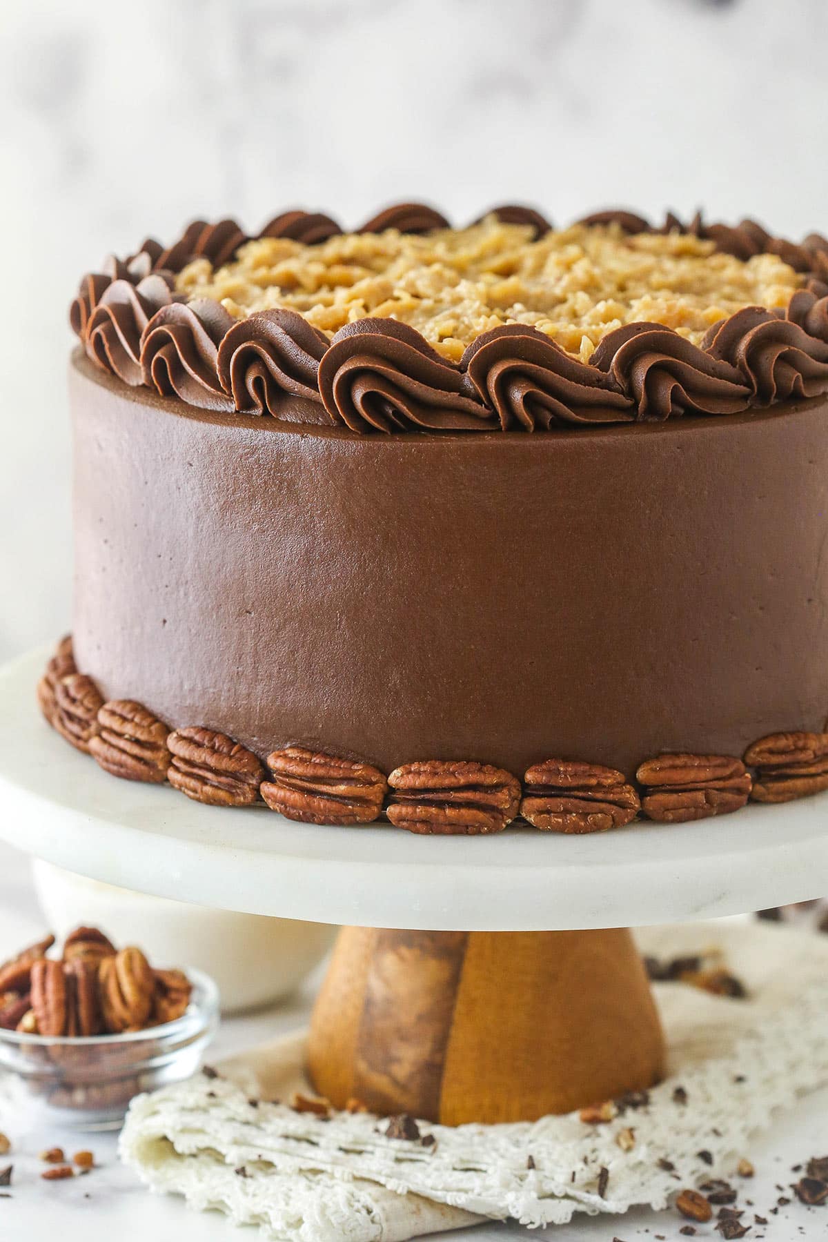 German chocolate cake on a cake stand.