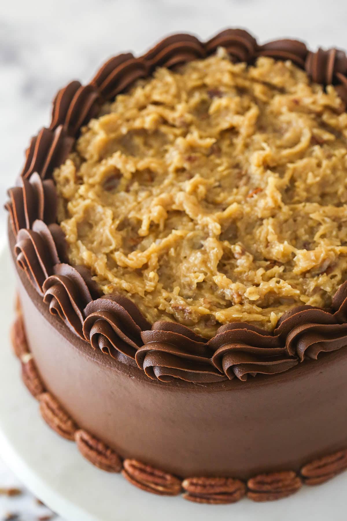 Overhead image of German chocolate cake on a cake stand.