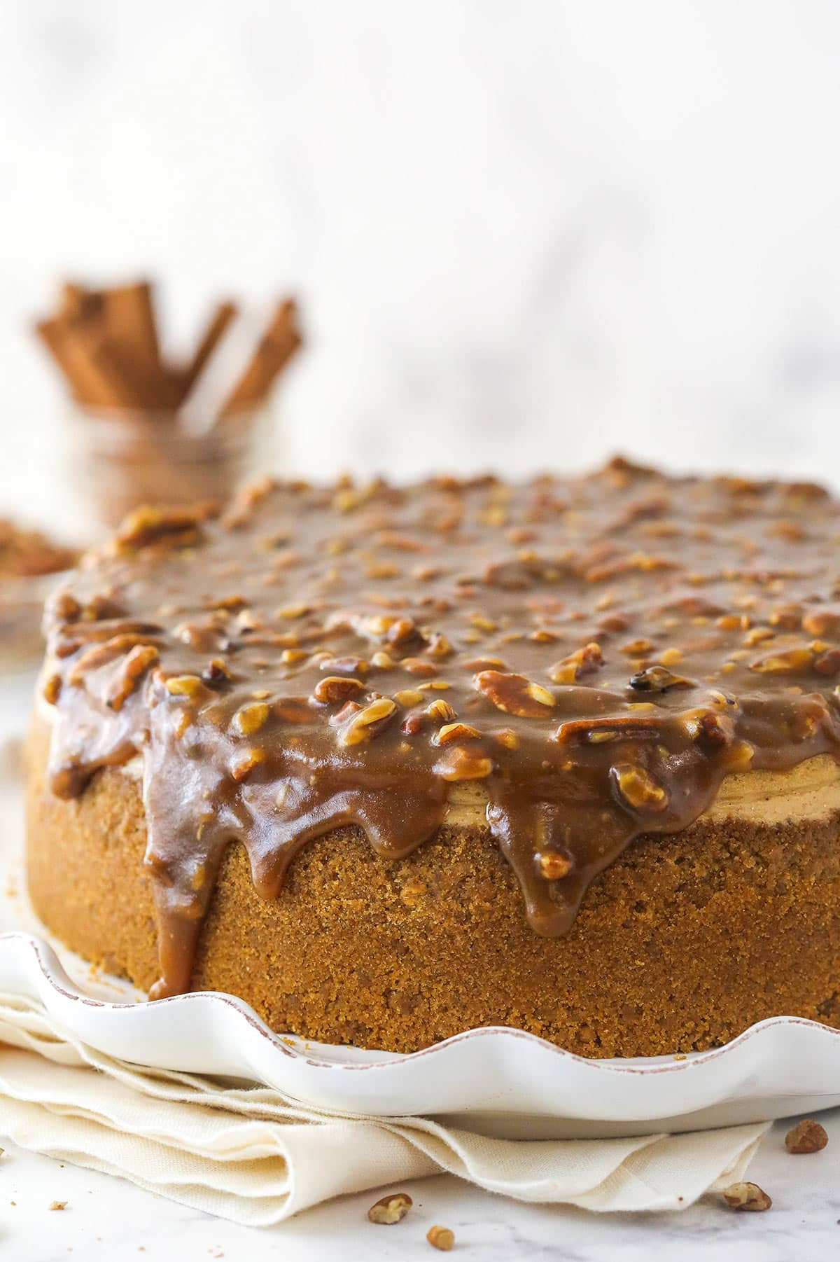 Pecan pie cheesecake on a serving platter.