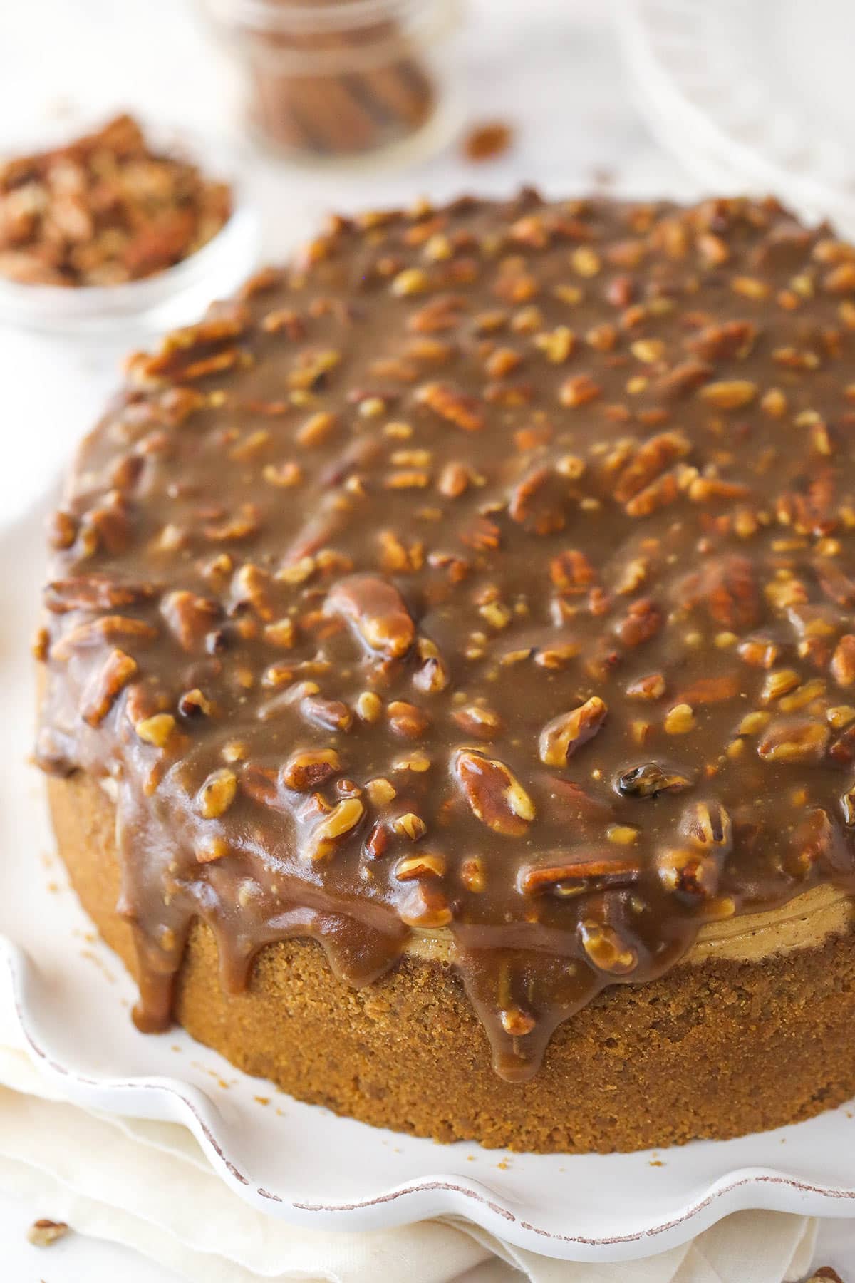 Overhead image of pecan pie cheesecake on a serving platter.