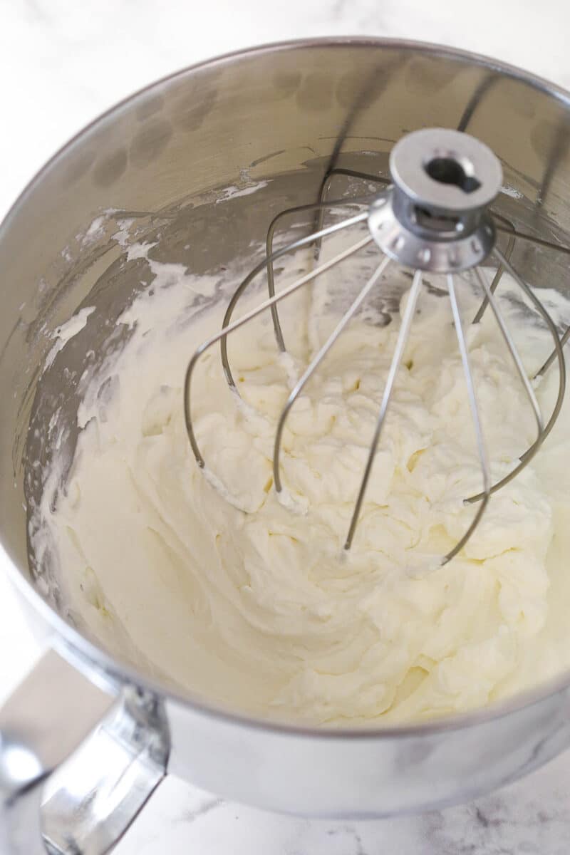 Whipped cream in a mixing bowl.