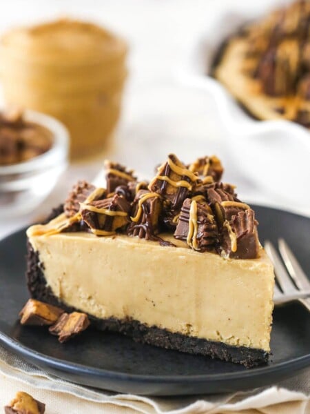 A slice of Reese's peanut butter pie on a plate with a fork.