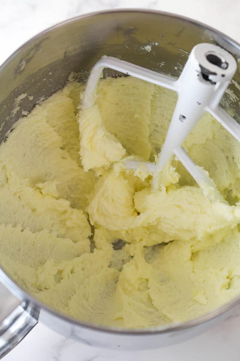 Creaming together butter and sugar for chocolate sugar cookie dough.