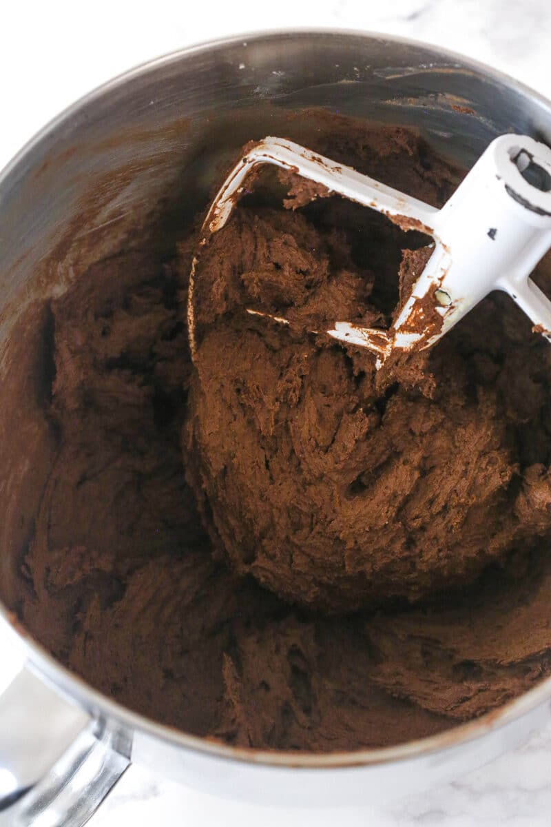 Chocolate sugar cookie dough in a mixing bowl.