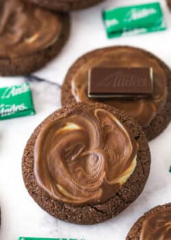 Overhead image of Andes mint cookies. One has an Andes mint on top of it.