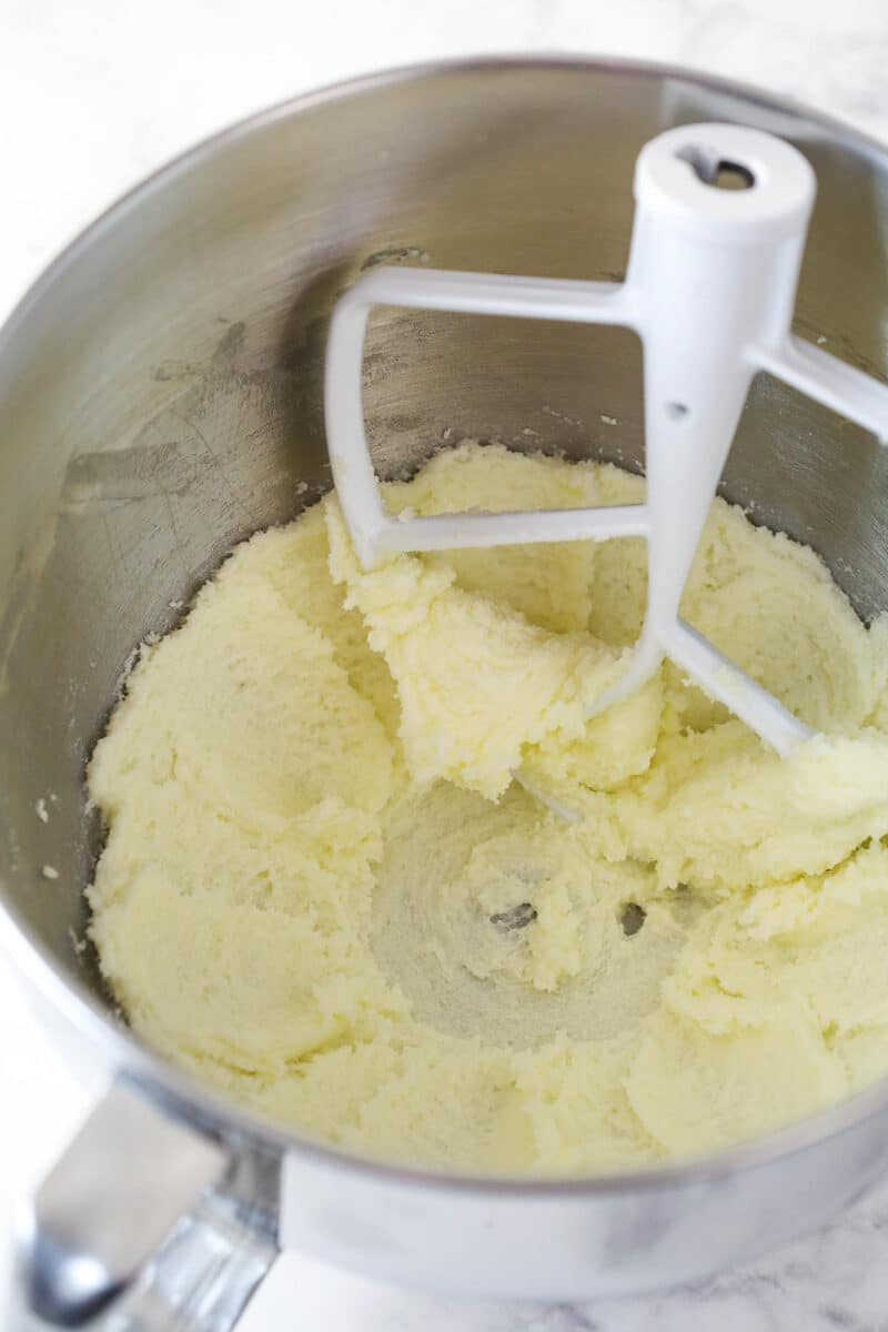 Creaming together butter, sugar, and vanilla for cookie dough.